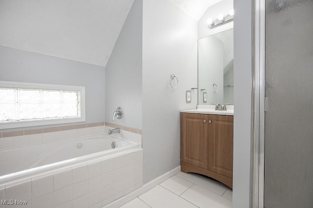 11915 Franklin Blvd, Lakewood, OH 44107 - full bathroom featuring vaulted ceiling, vanity, tile patterned flooring, baseboards, and a bath