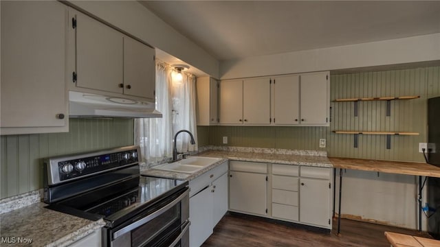 kitchen featuring under cabinet range hood, a sink, white cabinets, double oven range, and dark wood finished floors