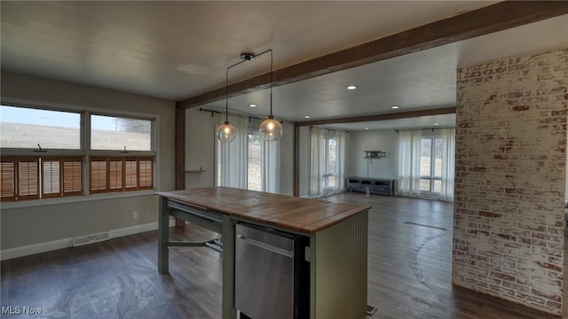 kitchen featuring baseboards, visible vents, brick wall, dark wood-style flooring, and beamed ceiling