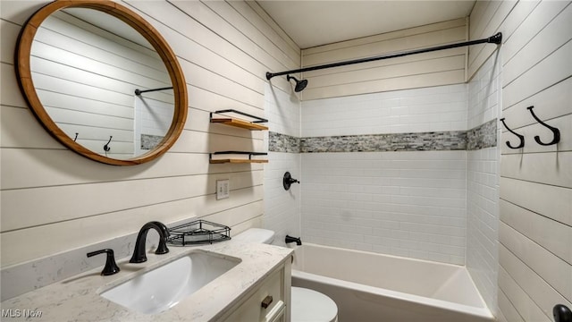 full bathroom with bathing tub / shower combination, vanity, and toilet