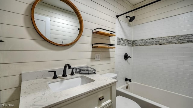 bathroom featuring  shower combination, vanity, and toilet