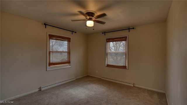 carpeted empty room with a baseboard heating unit, ceiling fan, a baseboard radiator, and baseboards