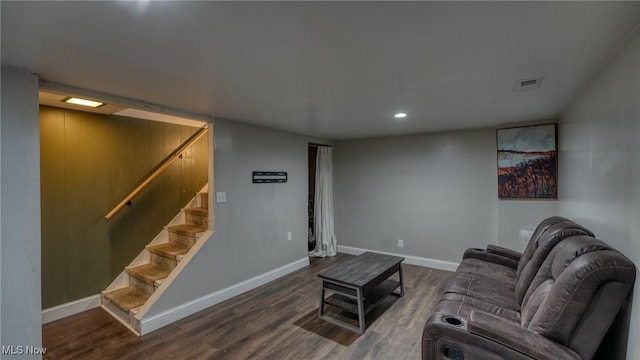 living area with recessed lighting, dark wood-style flooring, visible vents, baseboards, and stairway