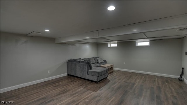 living area with dark wood-style floors, baseboards, visible vents, and recessed lighting