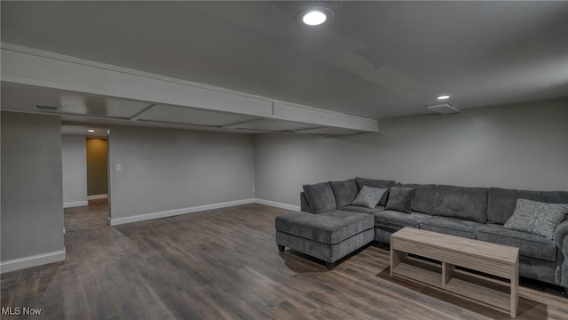 living area with recessed lighting, baseboards, and wood finished floors