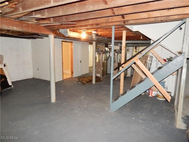 unfinished below grade area featuring stairway