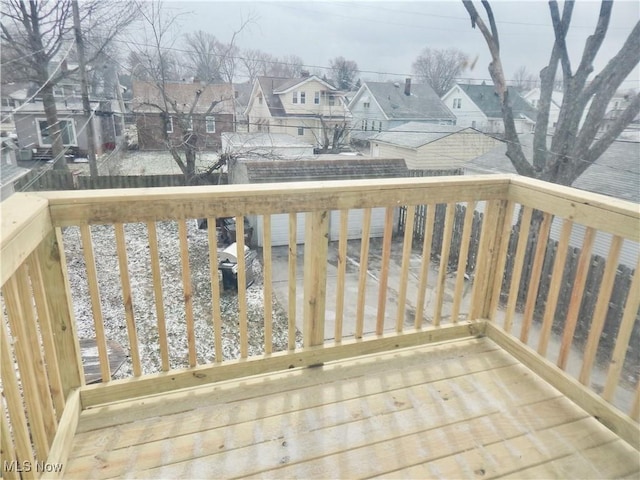 wooden deck with a residential view