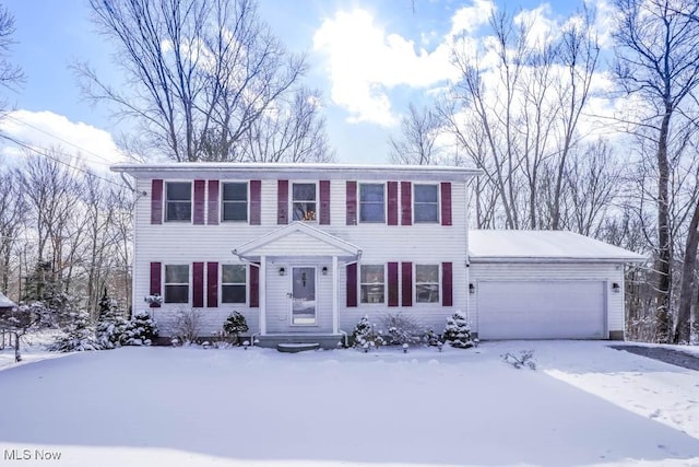 colonial house featuring an attached garage