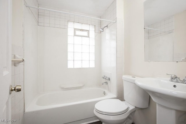 full bathroom with toilet, shower / tub combination, and a sink