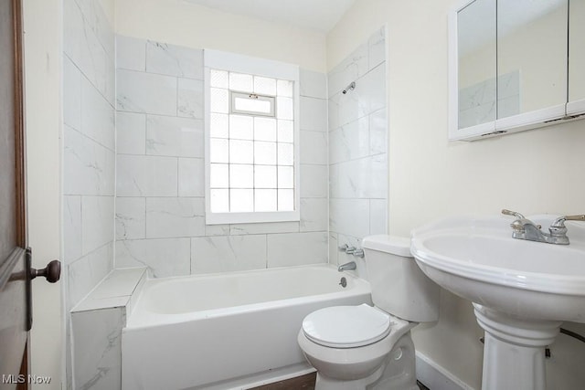 bathroom featuring  shower combination and toilet