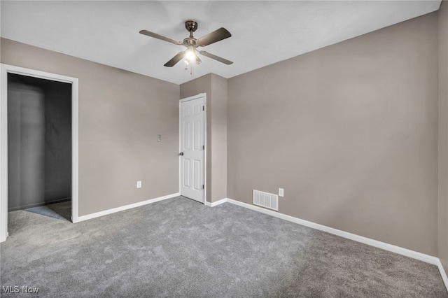 unfurnished bedroom featuring carpet floors, visible vents, and baseboards