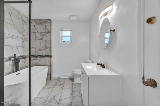 bathroom featuring visible vents, toilet, marble finish floor, a textured ceiling, and a freestanding bath