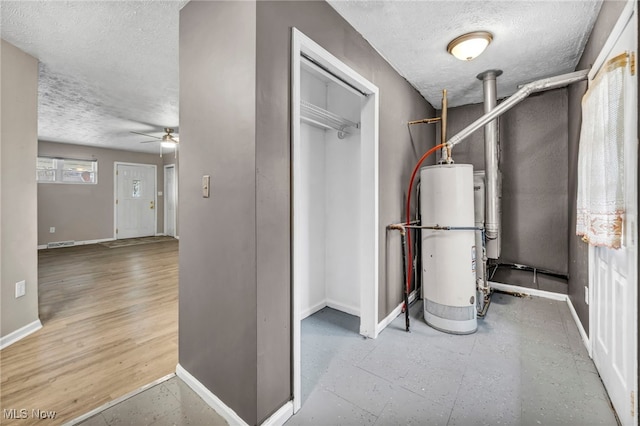 utility room with gas water heater and visible vents