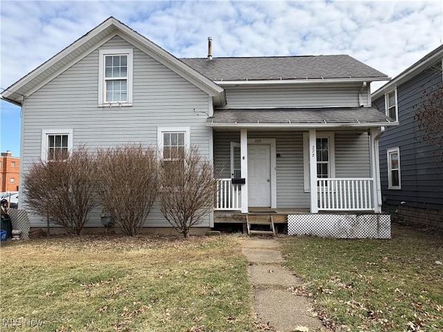 bungalow-style house featuring a porch, a front yard, and roof with shingles