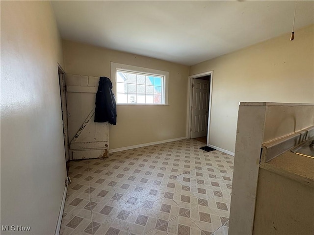 interior space featuring baseboards