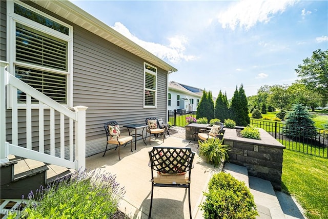 view of patio / terrace featuring fence and an outdoor hangout area