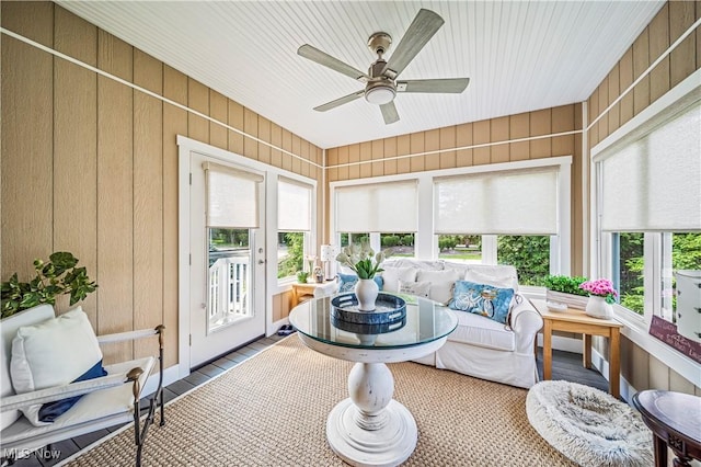 sunroom featuring a ceiling fan