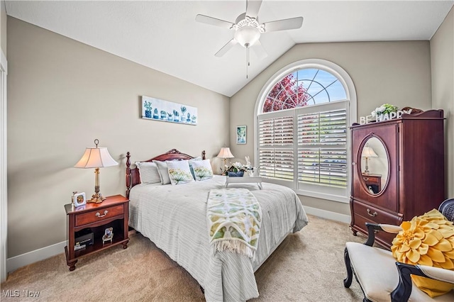 bedroom with light carpet, baseboards, and lofted ceiling