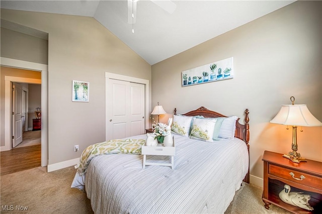 carpeted bedroom featuring high vaulted ceiling, a closet, ceiling fan, and baseboards