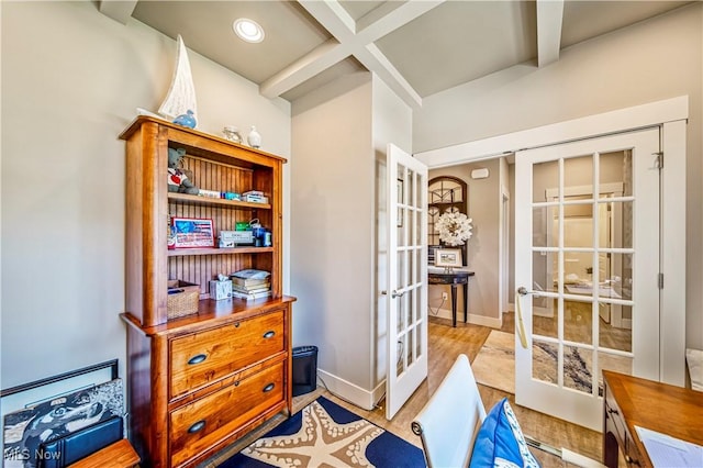 interior space with french doors, coffered ceiling, beamed ceiling, and baseboards