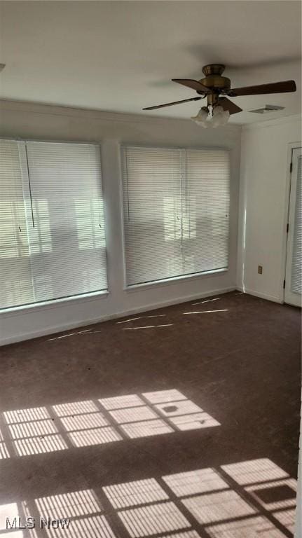 spare room with visible vents and baseboards