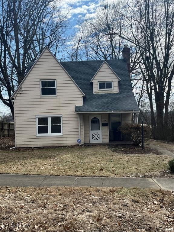 view of front of house featuring a porch and roof with shingles