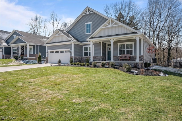 craftsman-style house with a garage, concrete driveway, a porch, a front lawn, and board and batten siding