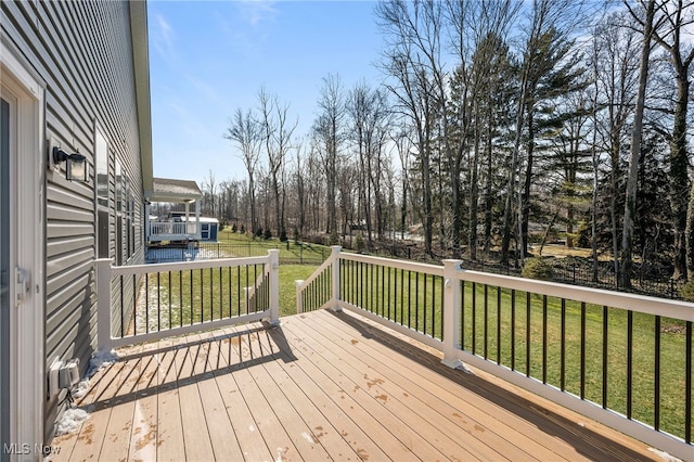 wooden deck with a yard