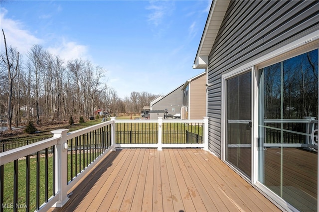 wooden terrace with a yard