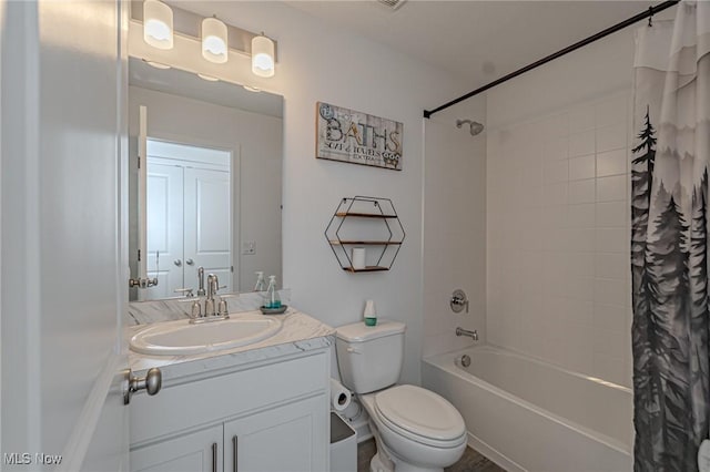 full bath featuring shower / tub combo, vanity, and toilet