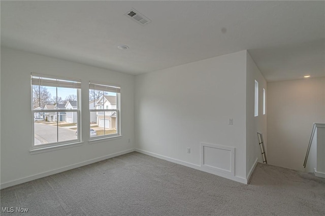 carpeted empty room with recessed lighting, visible vents, and baseboards