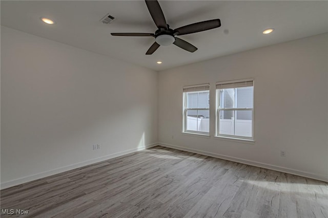 unfurnished room with baseboards, visible vents, a ceiling fan, wood finished floors, and recessed lighting