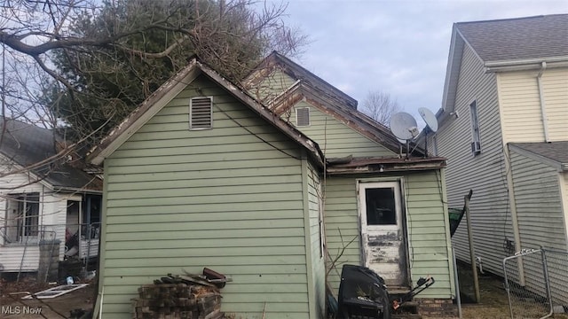 rear view of house with fence