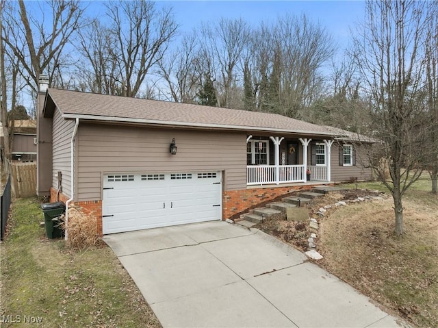 single story home with driveway, a garage, a shingled roof, covered porch, and brick siding