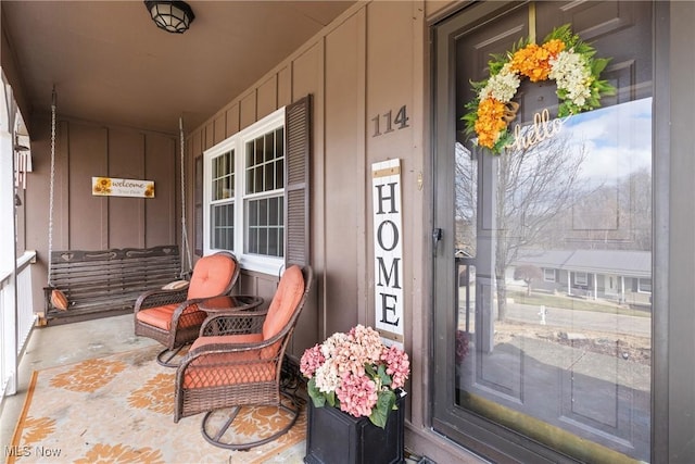 view of exterior entry with covered porch