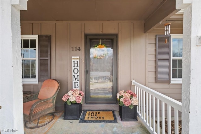 doorway to property featuring covered porch