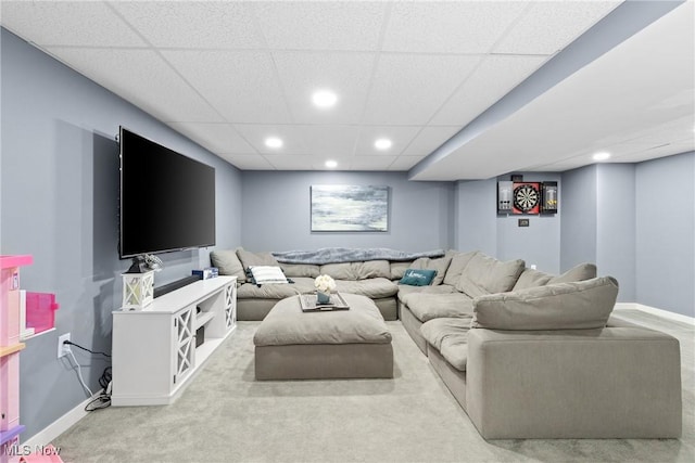 carpeted living room featuring baseboards and recessed lighting