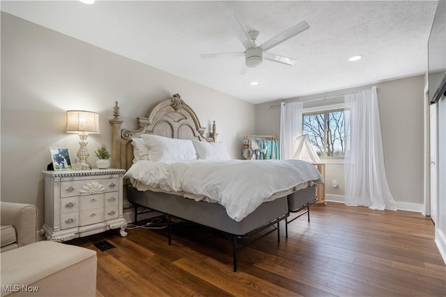 bedroom featuring ceiling fan, baseboards, wood finished floors, and recessed lighting