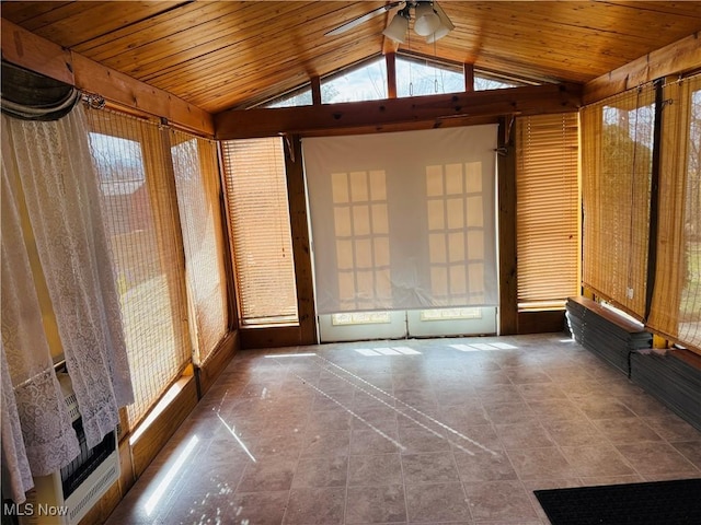 unfurnished sunroom with vaulted ceiling, wooden ceiling, and a wealth of natural light