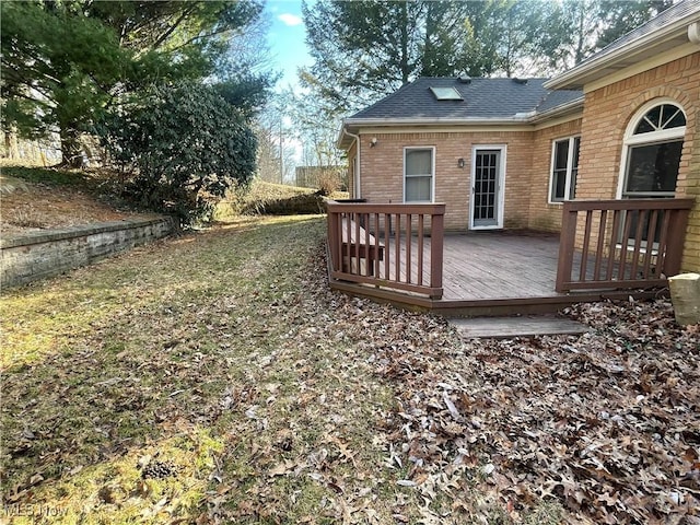 view of yard with a wooden deck