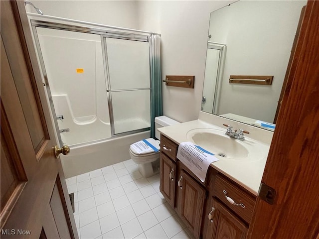 full bath featuring toilet, tile patterned flooring, bath / shower combo with glass door, and vanity