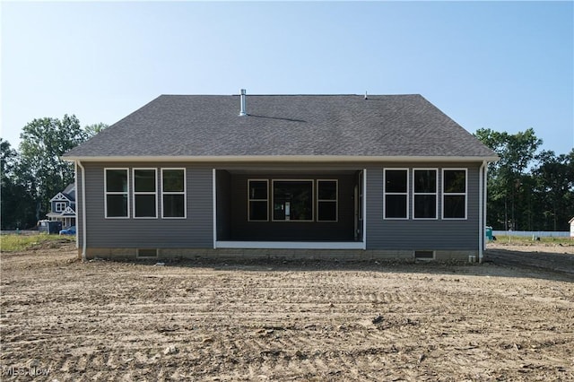 back of property featuring crawl space and roof with shingles