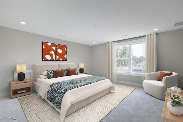 carpeted bedroom featuring recessed lighting, visible vents, and baseboards