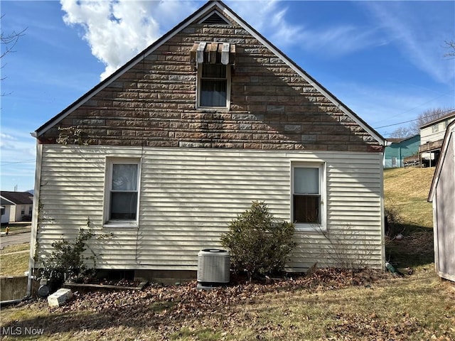 view of home's exterior with central AC