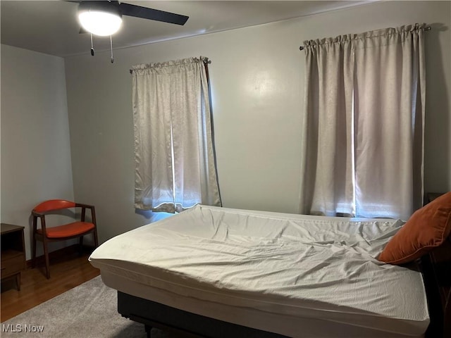 bedroom featuring wood finished floors