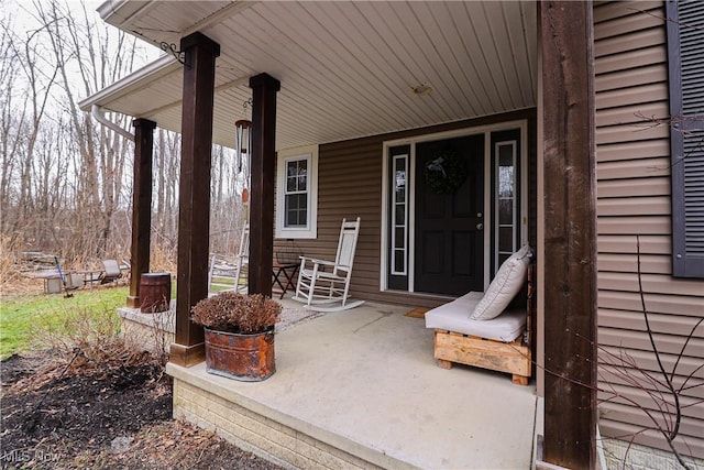 doorway to property with a porch