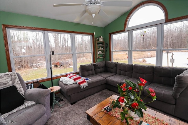 living room featuring lofted ceiling and a ceiling fan