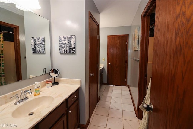 bathroom with vanity and tile patterned floors