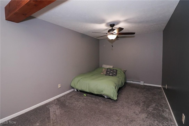 unfurnished bedroom featuring ceiling fan, baseboard heating, carpet, and baseboards