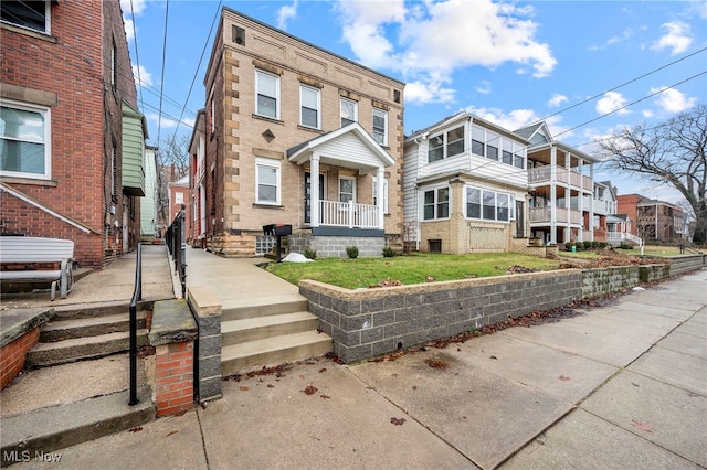 multi unit property featuring brick siding